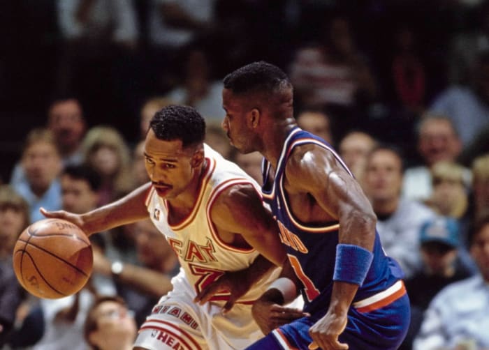 Keith Askins #2, Small Forward for the Miami Heat dribbles the basketball around #11 Terrell Brandon of the Cleveland Cavaliers during their NBA Atlantic Division basketball game on 11th December 1991 at the at the Miami Arena in Miami, Florida, United States. The Miami Heat won the game 105 - 103.